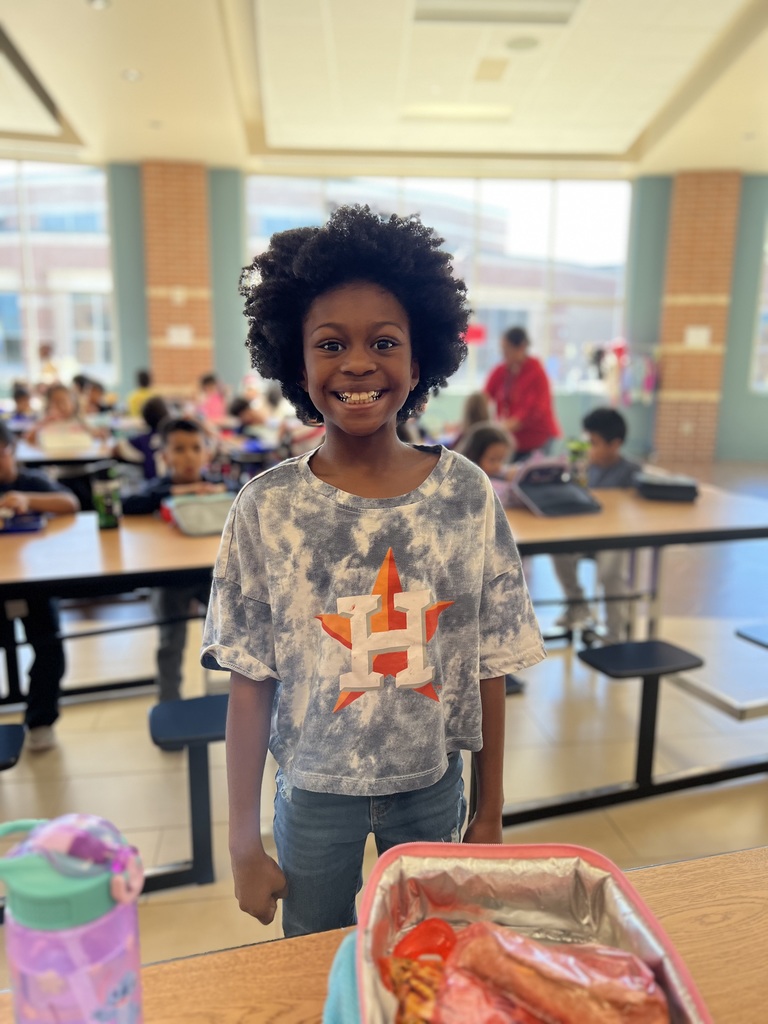 Student poses for team shirt day