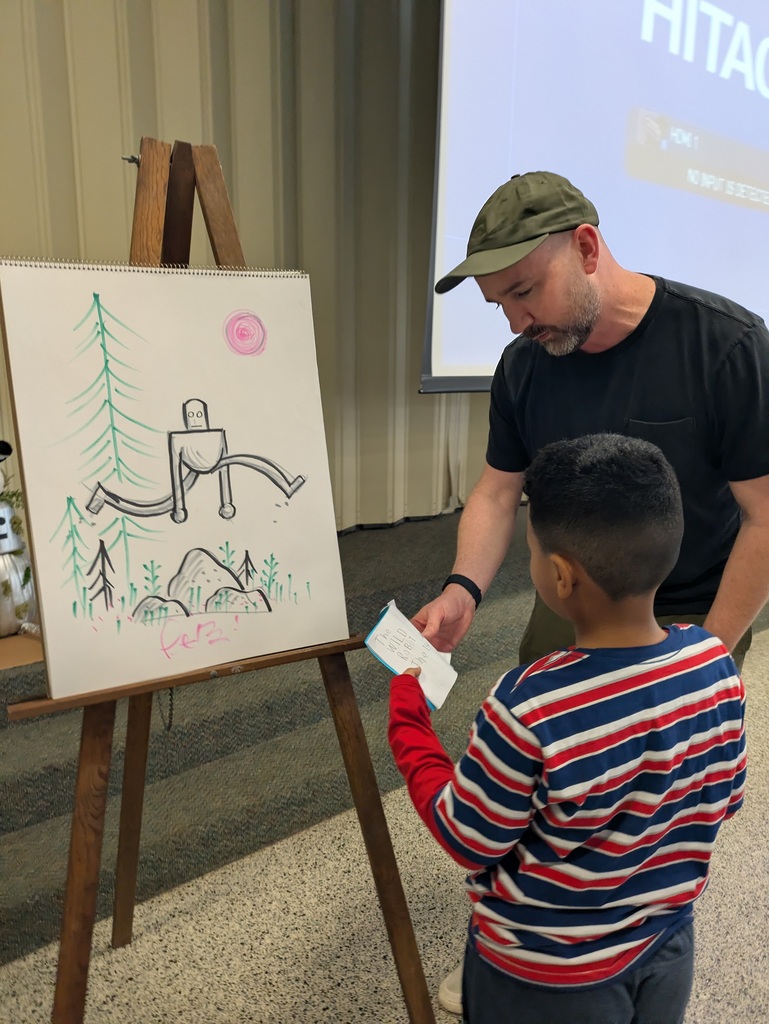 peter brown talking to a student