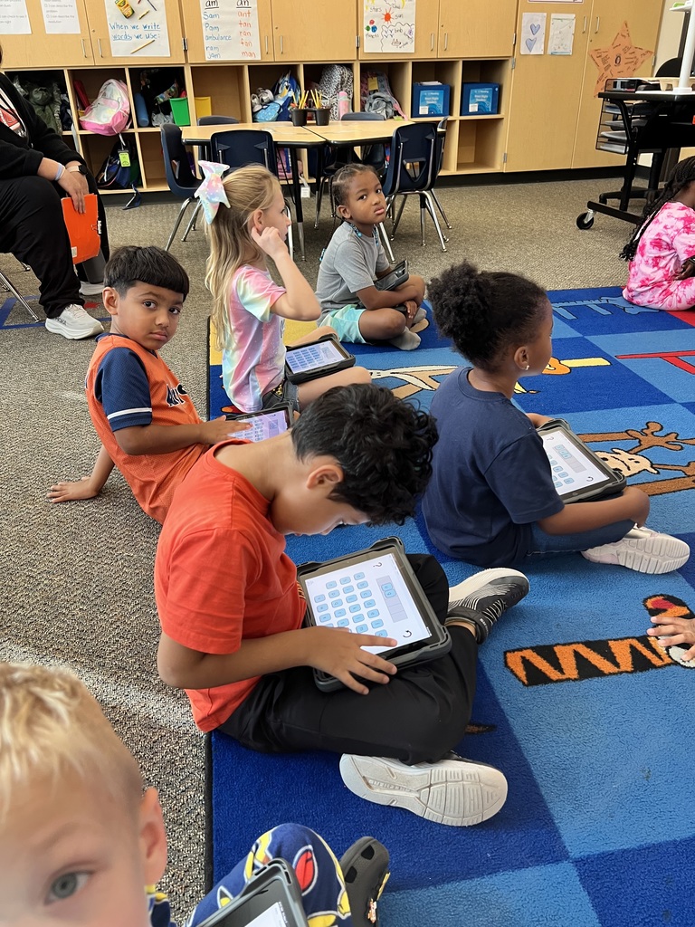 Students practicing word work on iPads