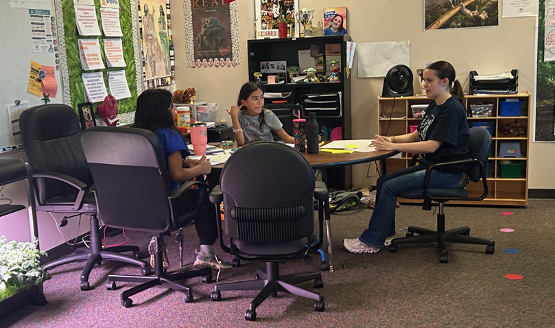 Klein Collins Student with a 5th grader 