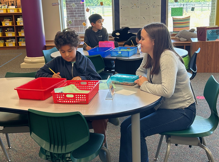 Klein Collins Student with a 5th grader 