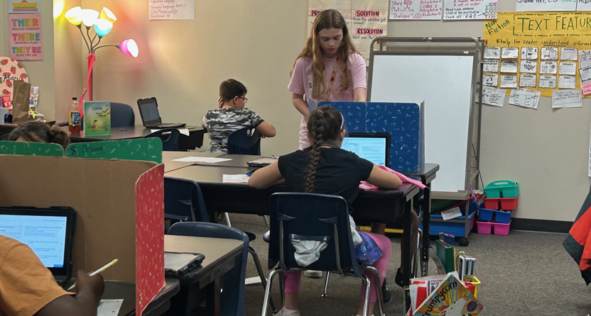 Klein Collins Student with some 4th graders 