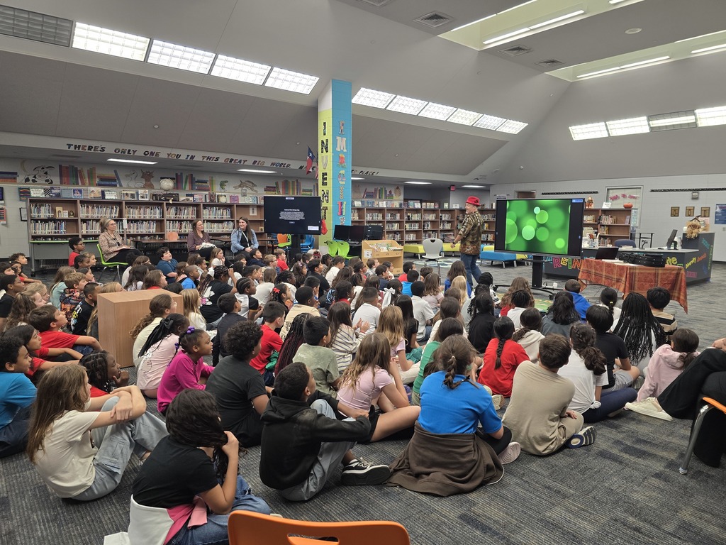 Students listen as MAS talks about writing