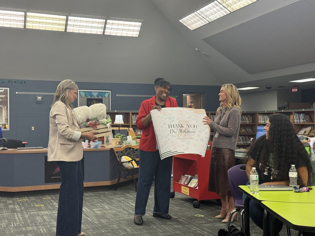 Presenting a gift and banner to Klein Superintendent 