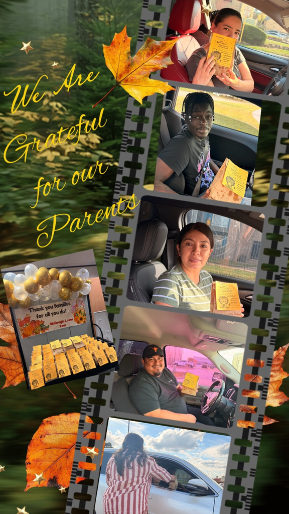 picture of parents smiling with a bag of popcorn