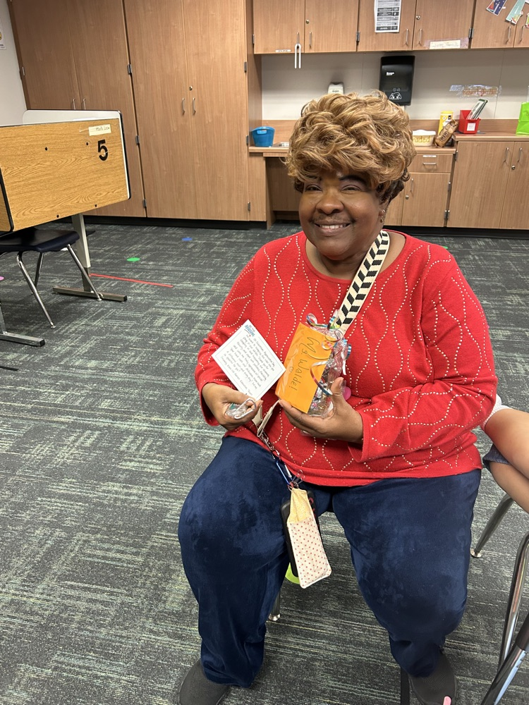 women sitting with red shirt.