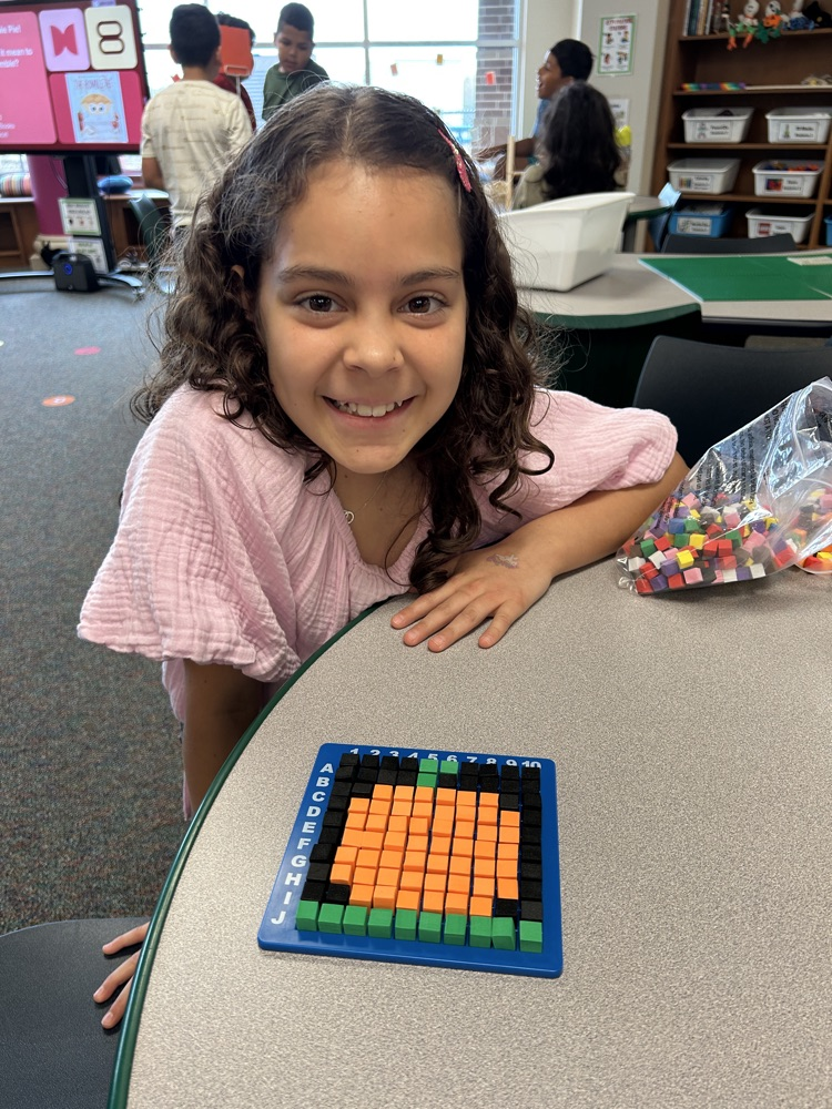 student with a pumpkin pixel art