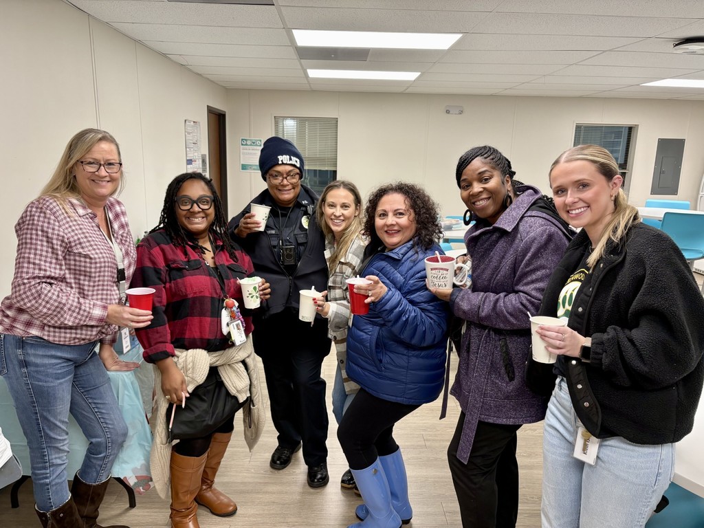 Teachers in flannel shirts drinking hot chocolate