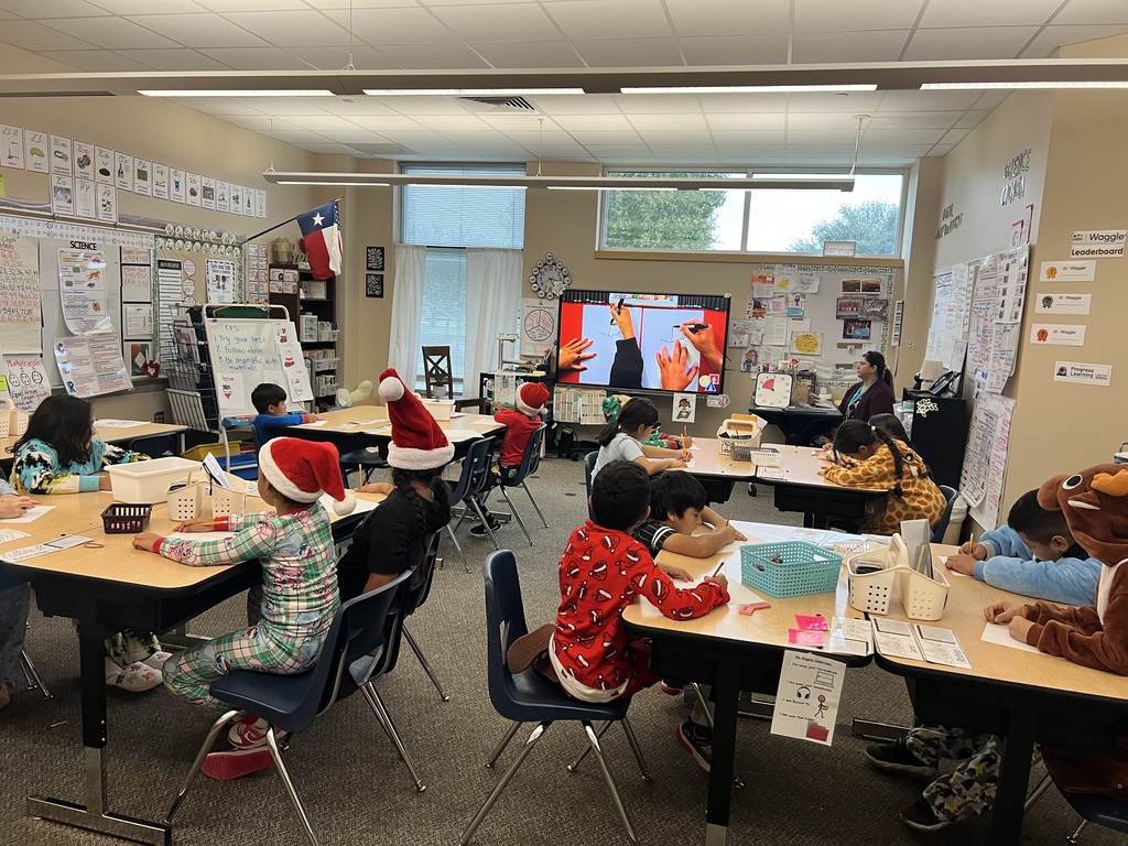Classroom of students are following a directed drawing activity on a screen