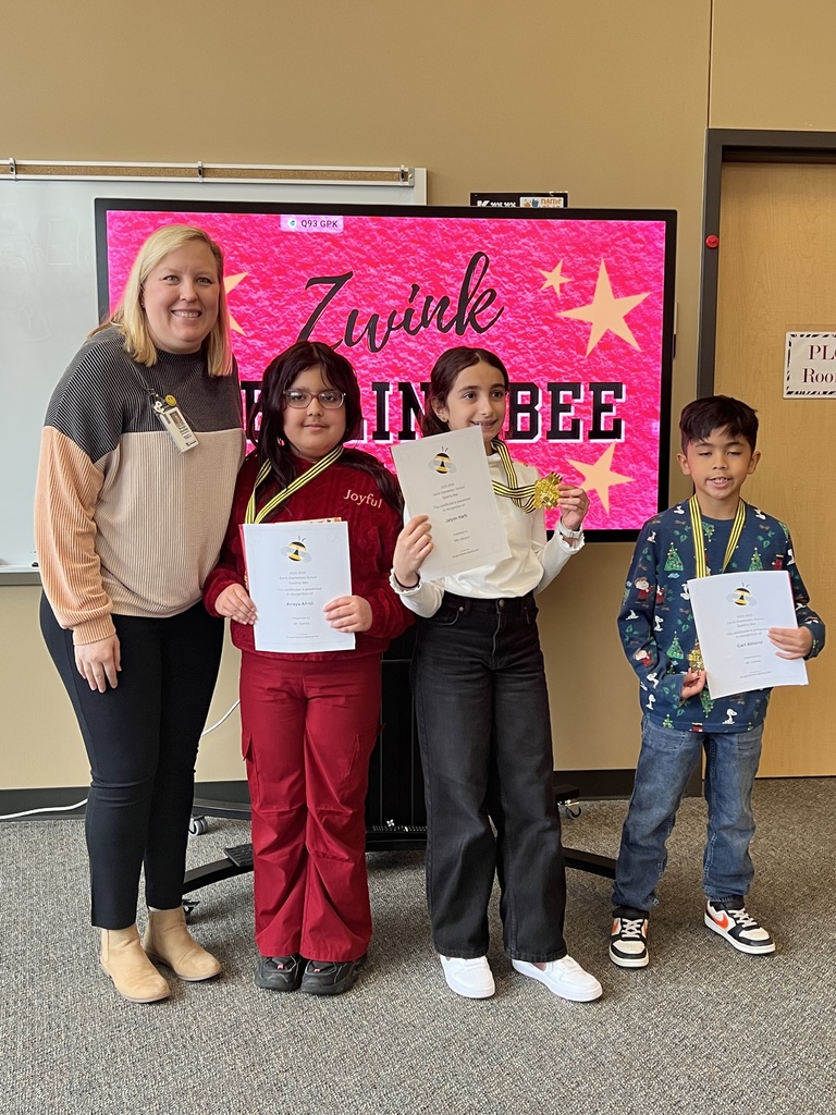 Assitnat principal poses with top 3 spelling bee student holding certificates and wearing medals