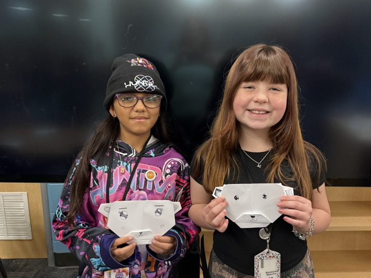 students creating origami