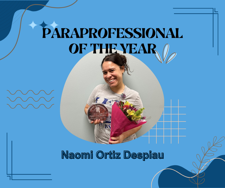 Woman smiling posing with an award and flowers