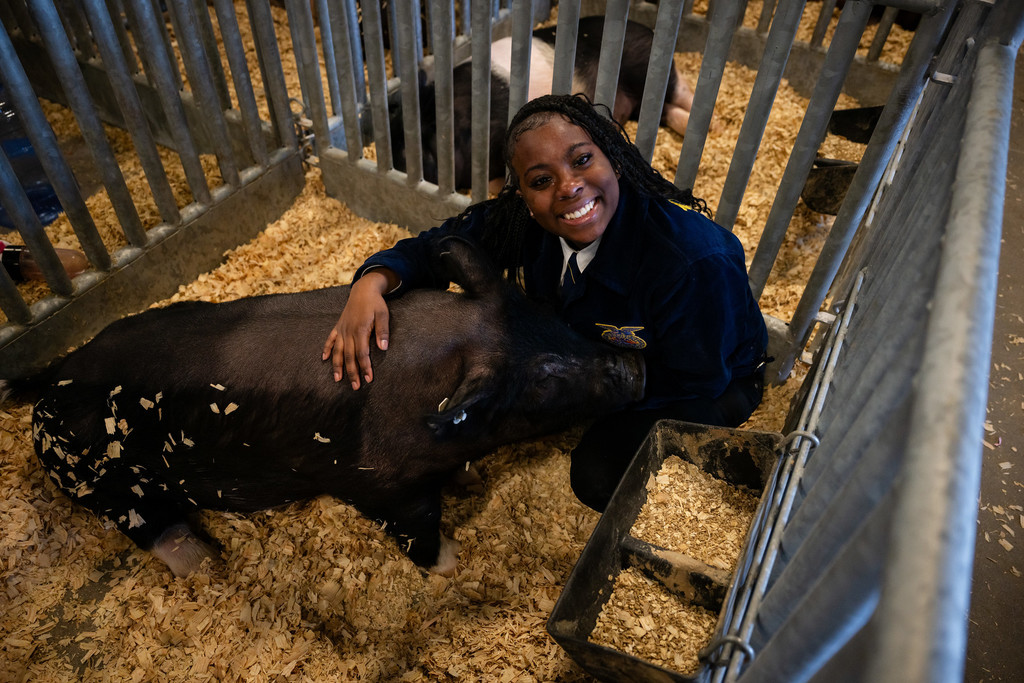 FFA Student with Pig