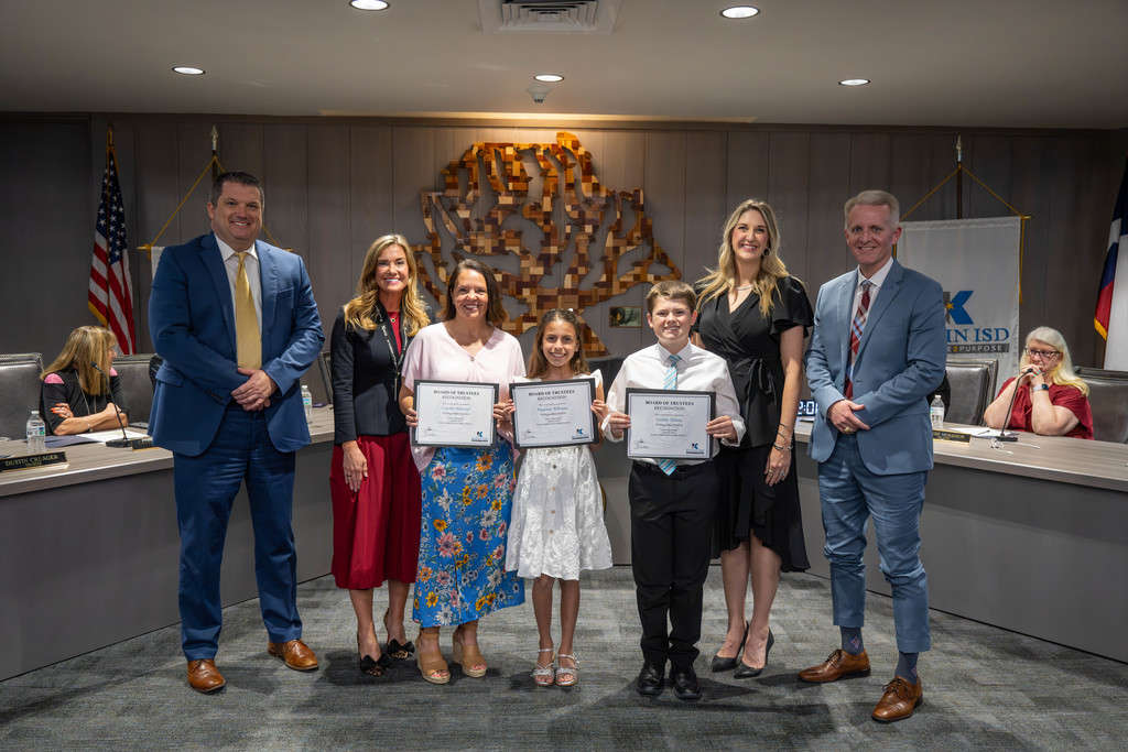 dr. jenny mcgown, teacher, student and principal posing for photo