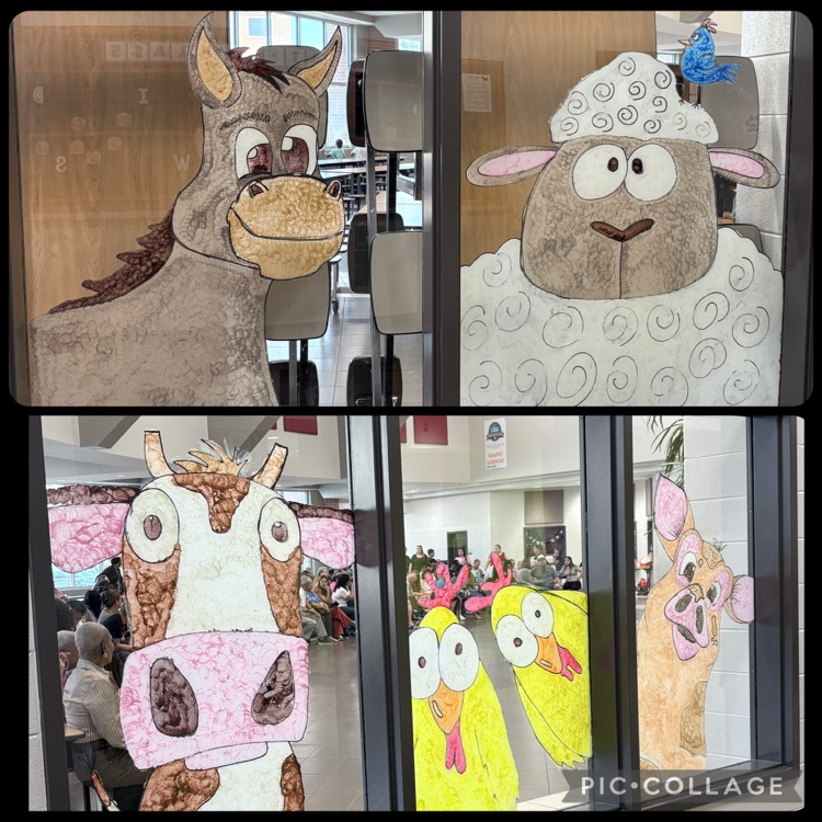 Image of Art Club paintings on the cafeteria windows  