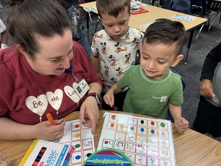 students coloring eggs
