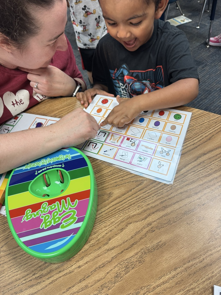 students coloring eggs