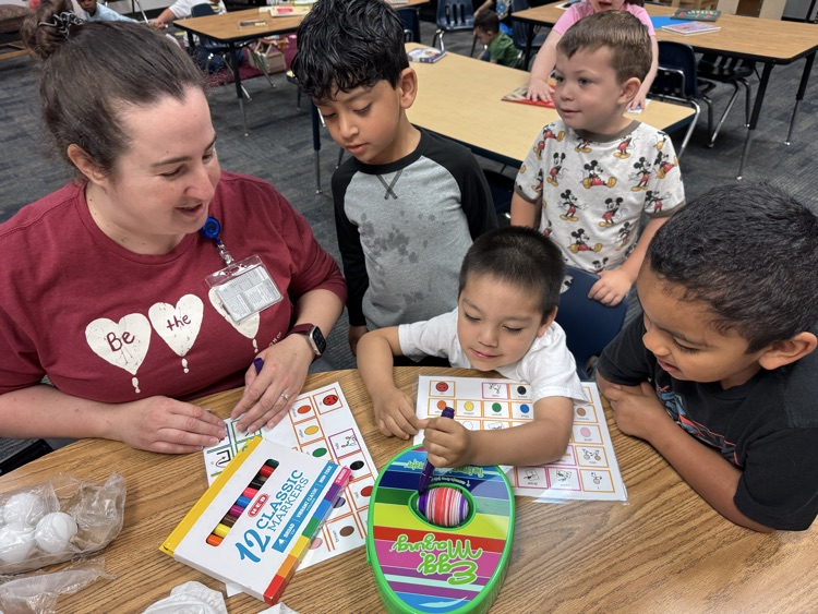 students coloring eggs