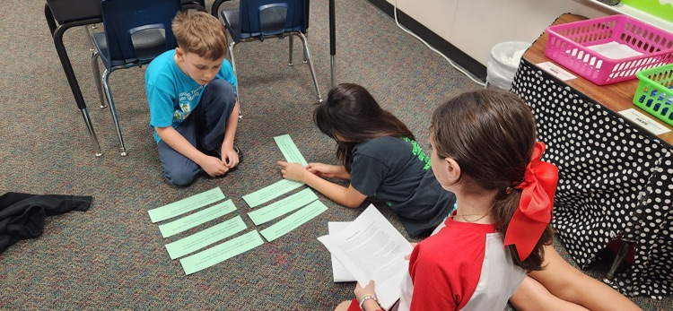 photo of students working together 