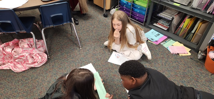 photo of students working together 