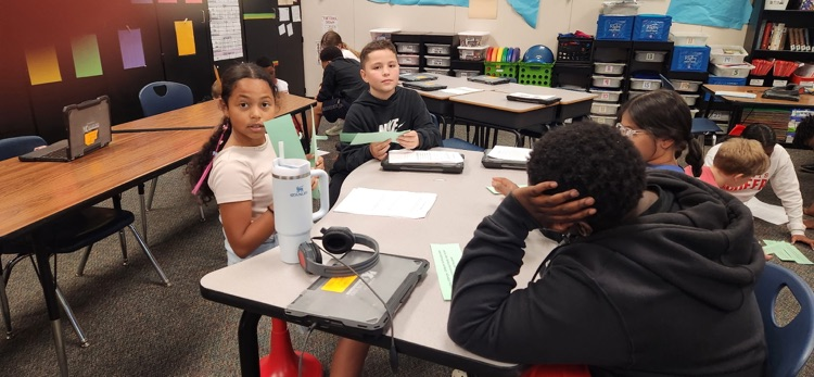 photo of students working together 