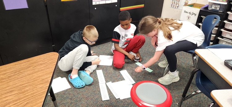 photo of students working together 