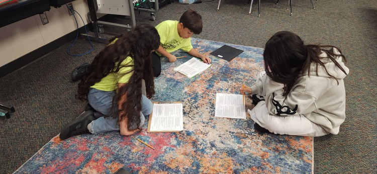 photo of students working together 