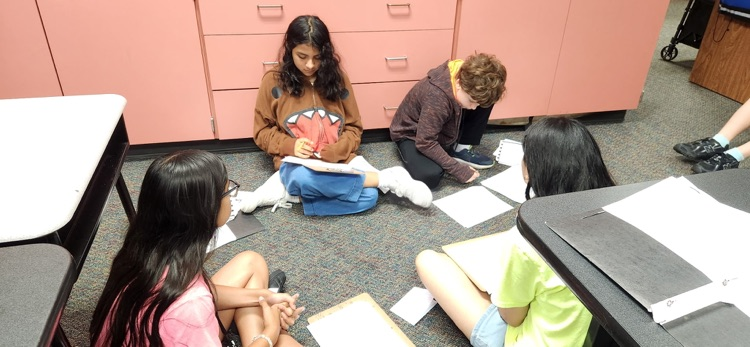 photo of students working together 