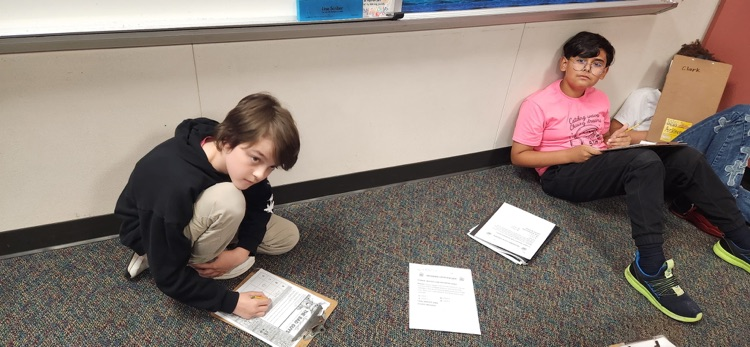 photo of students working together 