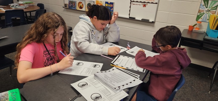 photo of students working together 