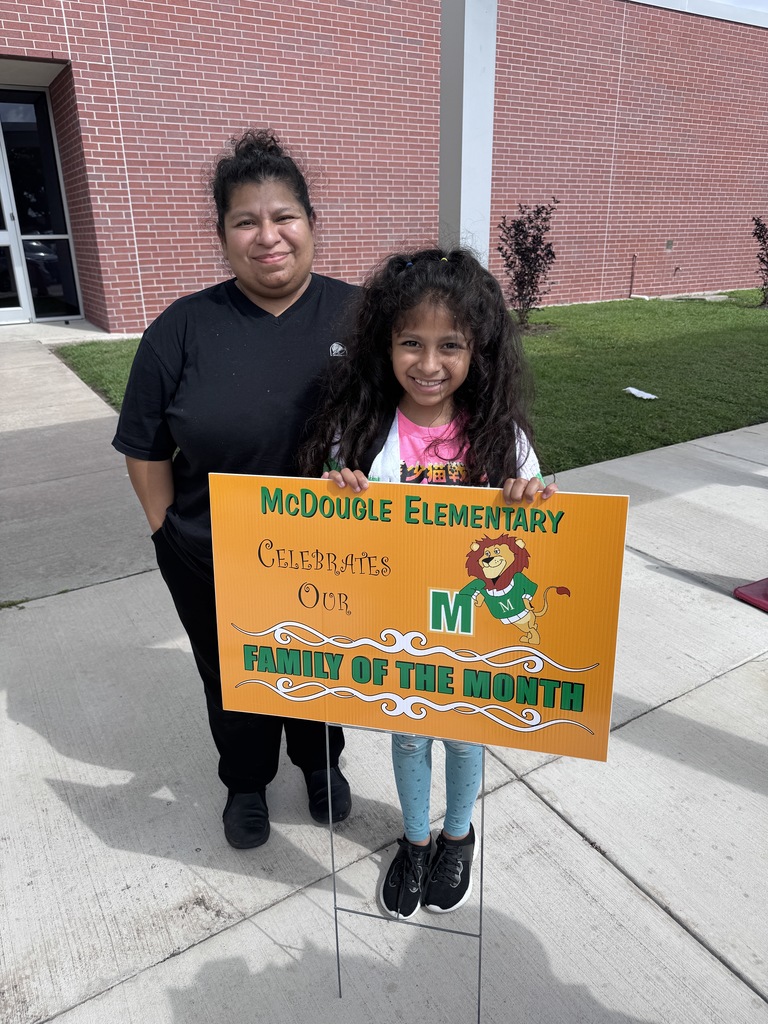 Mom and daughter with yard sign