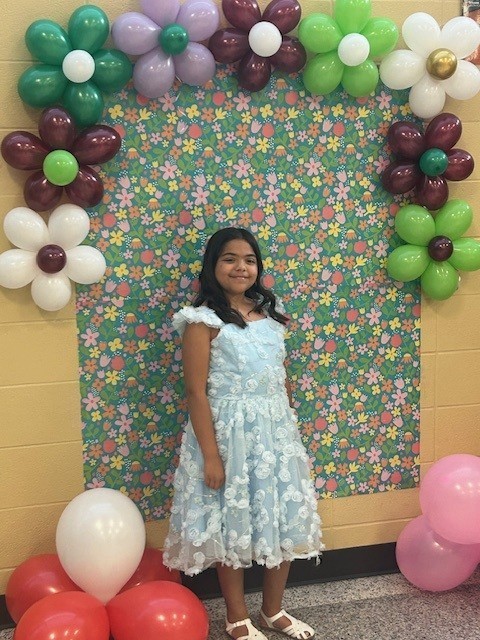 Young girl dressed up for school dance.