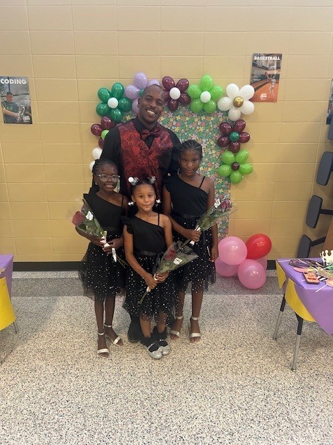 Father and daughter at school dance.