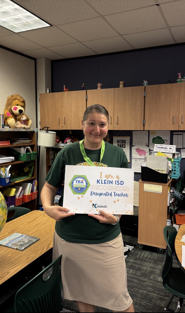 An educator holding certificate of accomplishment. 