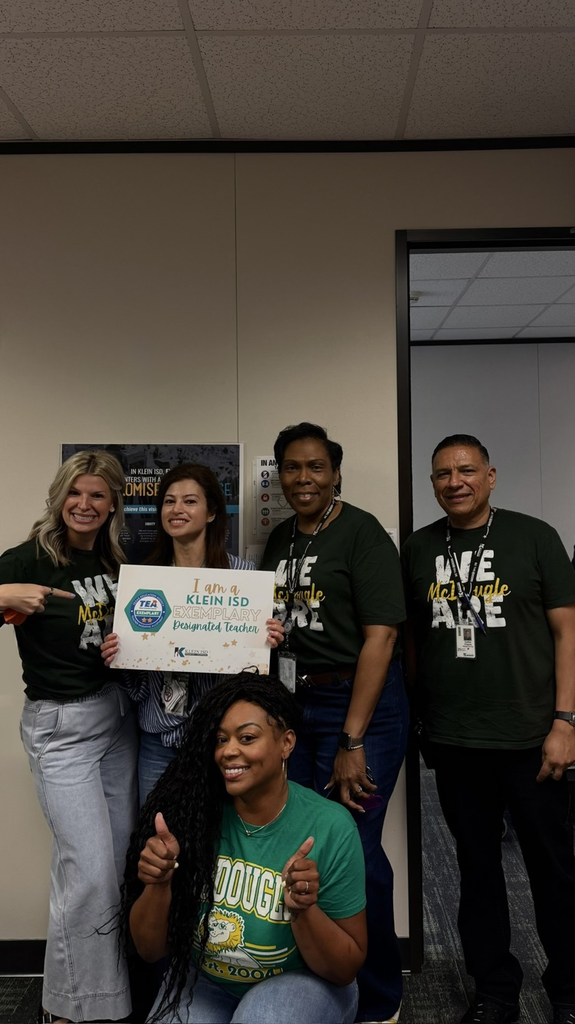 Group of educators celebrating a teacher’s achievement. 