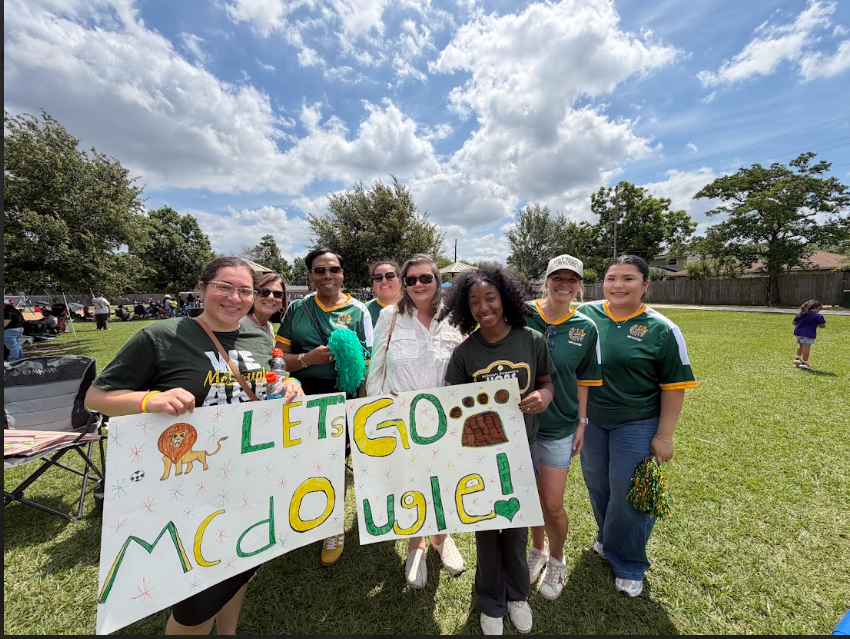 Educators out supporting their students during soccer tournament.