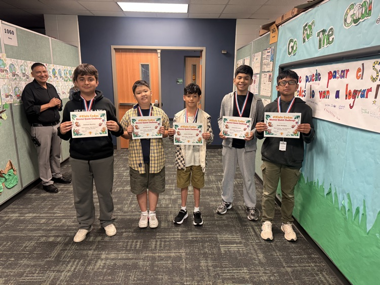 Group of students with medals. 