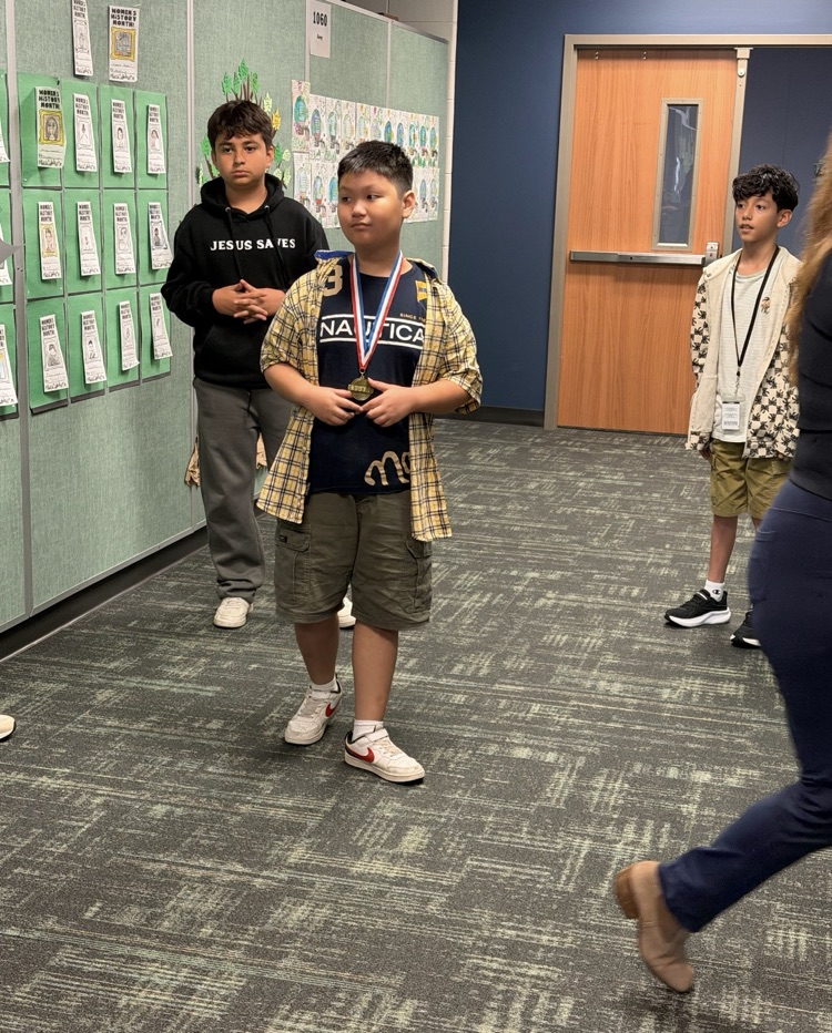 Group of students receiving medals.  