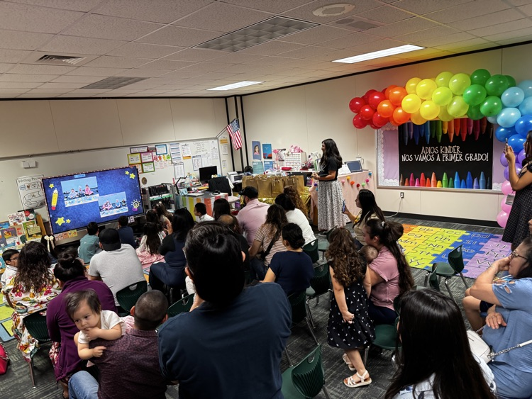 room full of excited families for their kindergarten student. 