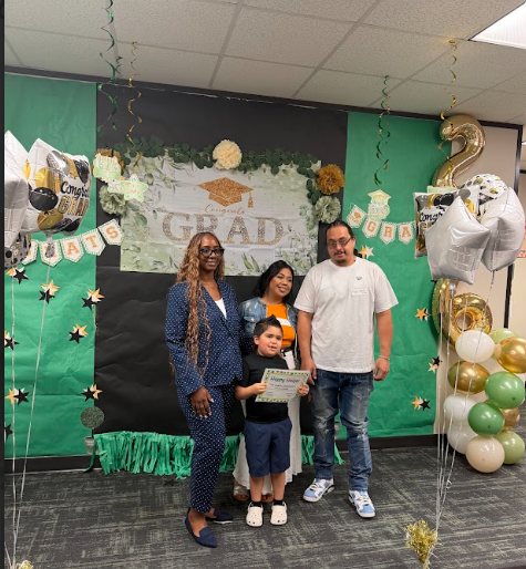 Student, Family and educator celebrating achievement.