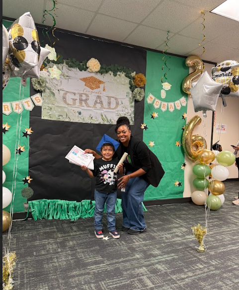 Student and Educator with achievement award