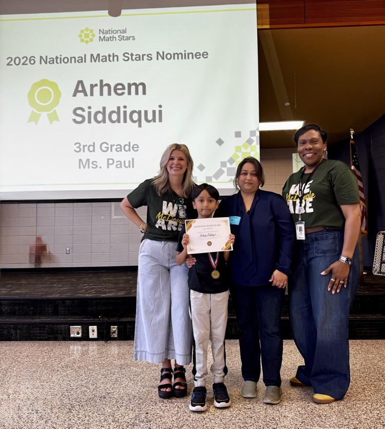 educators, parent and student standing with math star certificate 