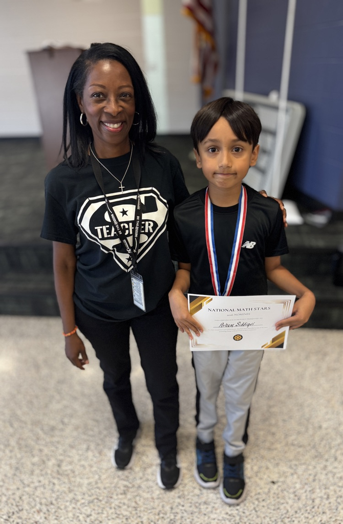 student standing with student 