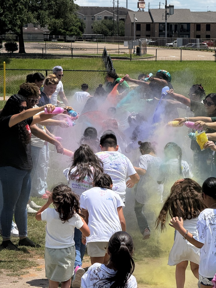 students running through the color run. 