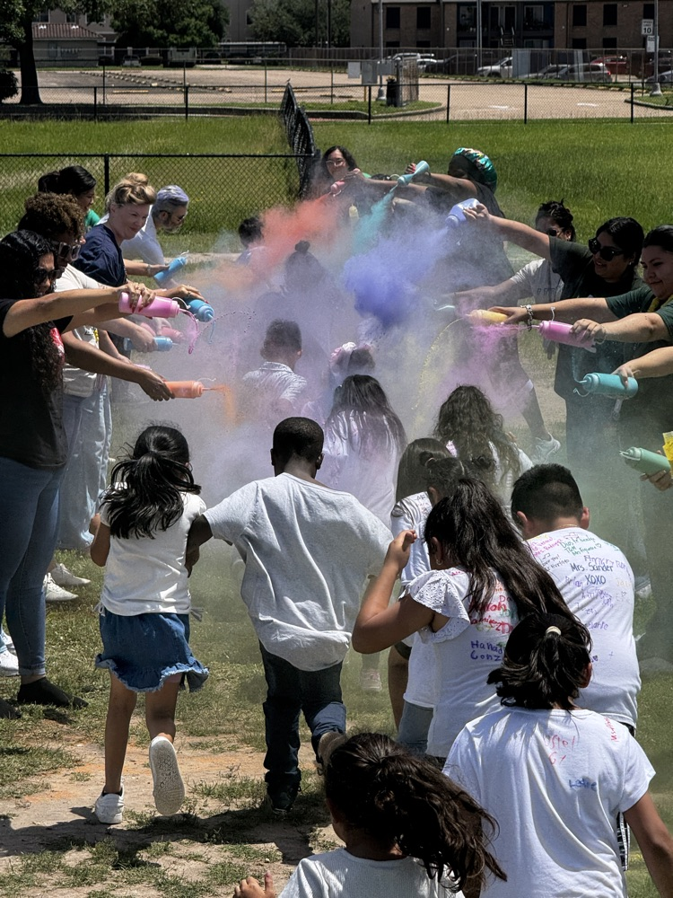students running through the color run. 