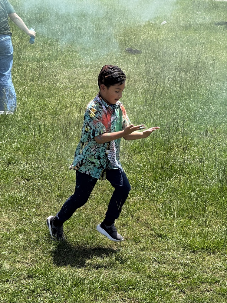 students running through the color run. 