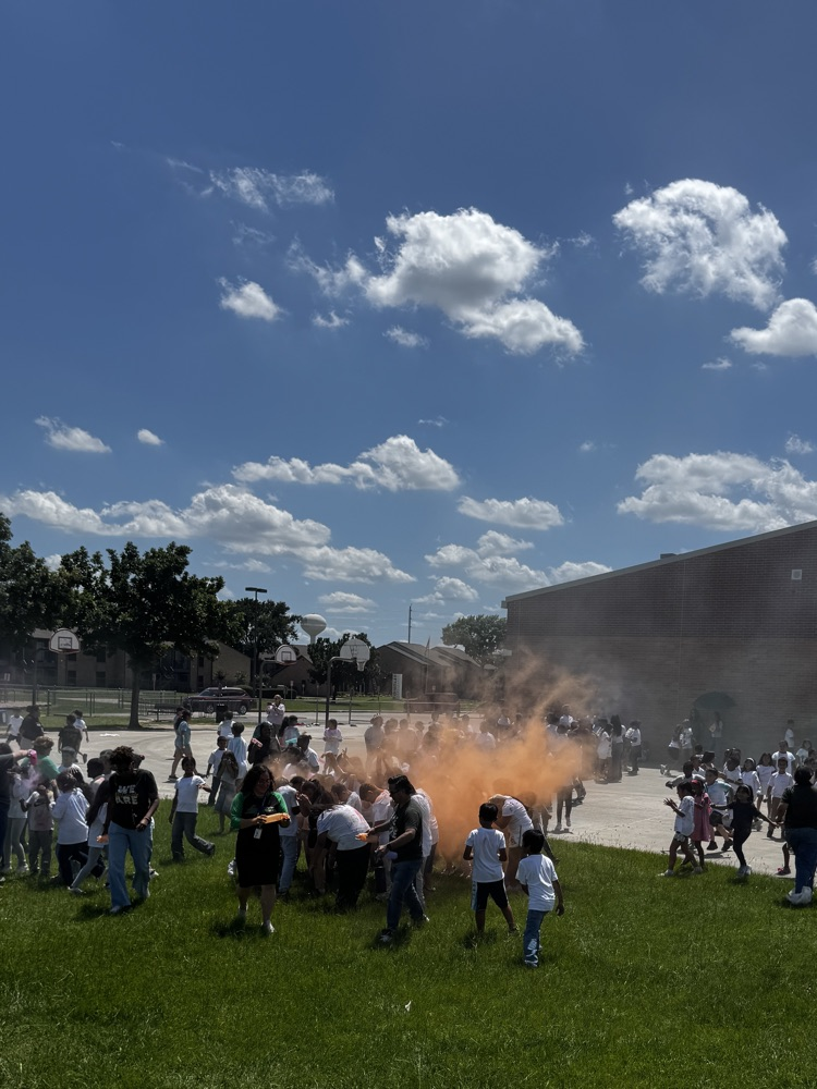 students running through the color run. 