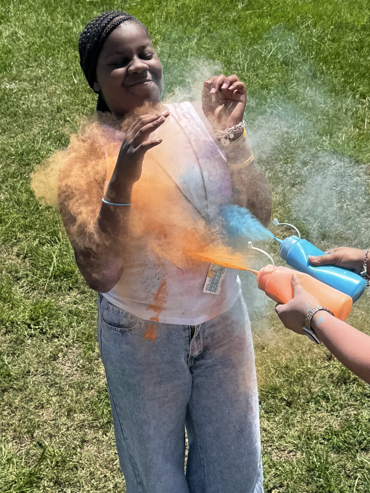 students running through the color run. 