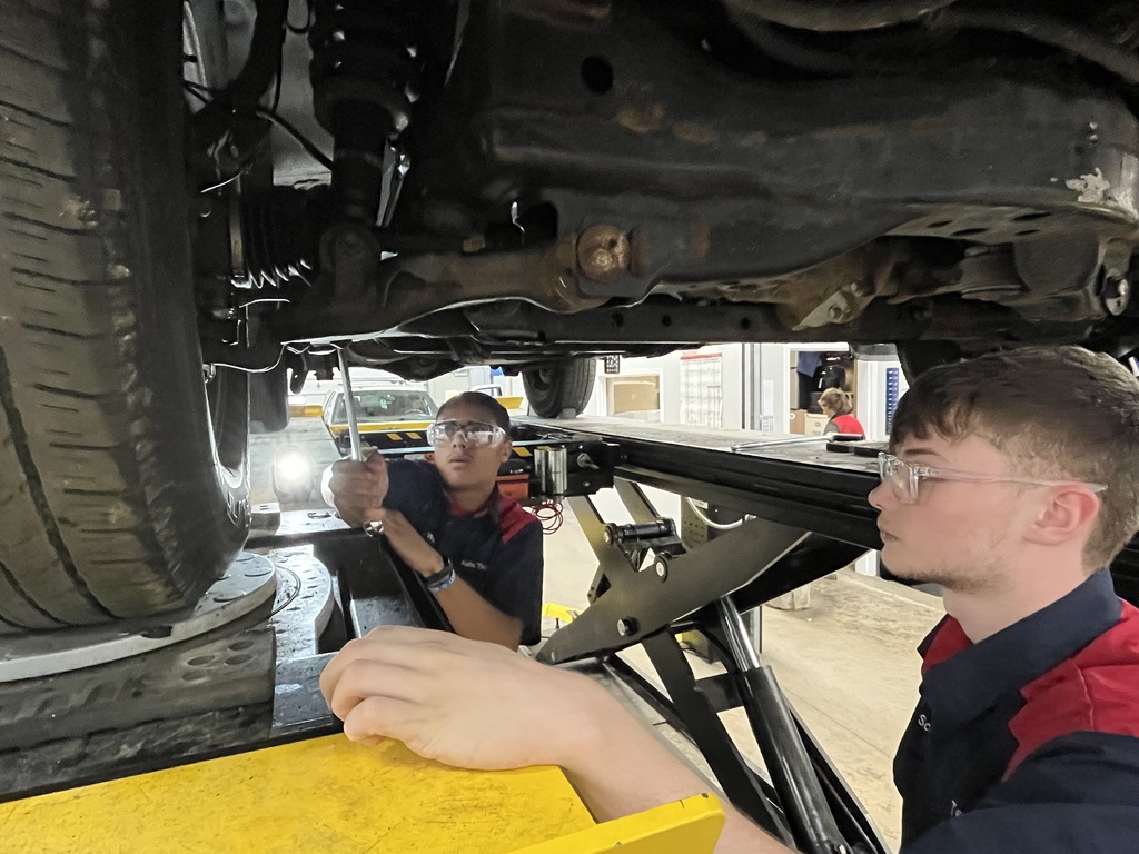 Students in Automotive Technology working on an issue