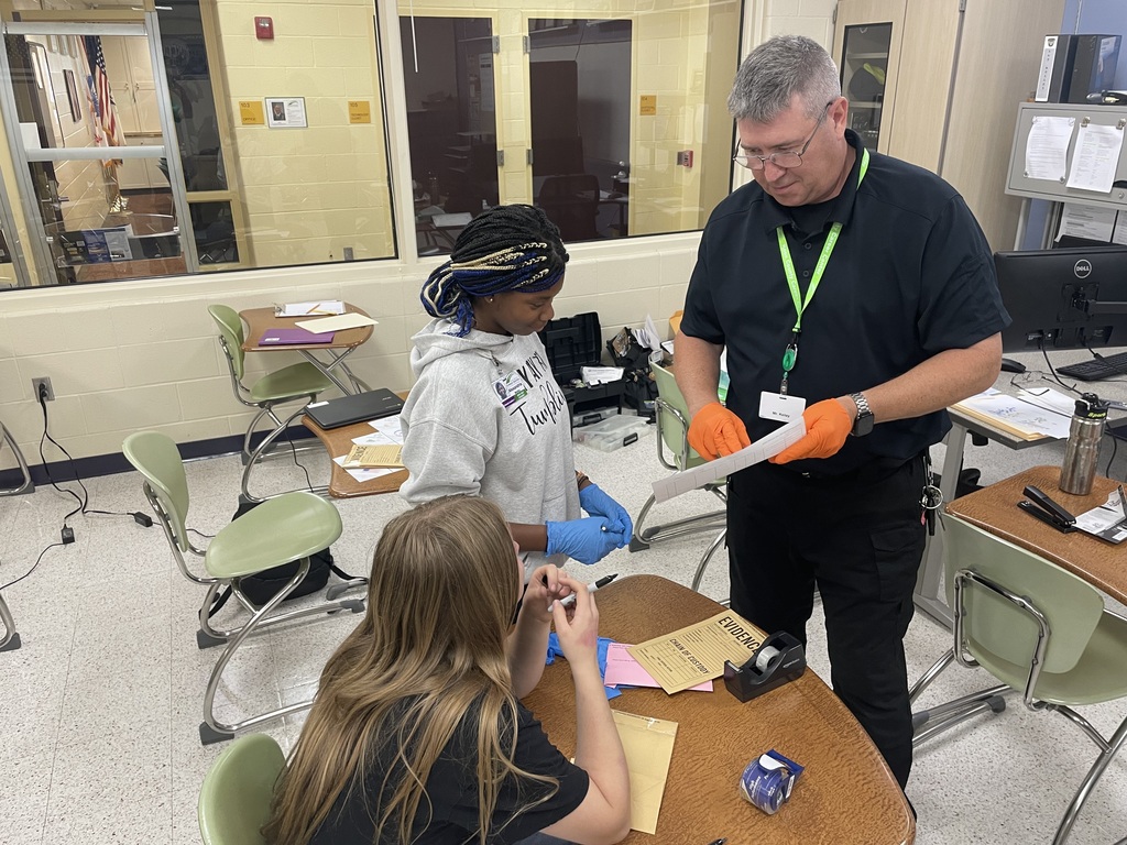 Criminal Justice instructor, Brian Kelley, working with students on evidence collecting.